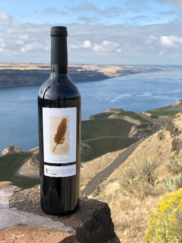 Bottle of Feather Cabernet Sauvignon overlooking the Columbia River